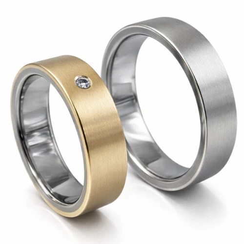 Vigselringar i titan och 14K vitt och gult guld med diamant 7 mm