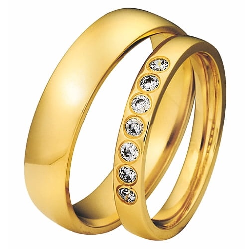 Vigselringar i 8k gult guld med 7 zirkonier Swarovski