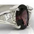Ring i 14k vitt guld med granat på 1ct och 2 diamanter på 0,08ct